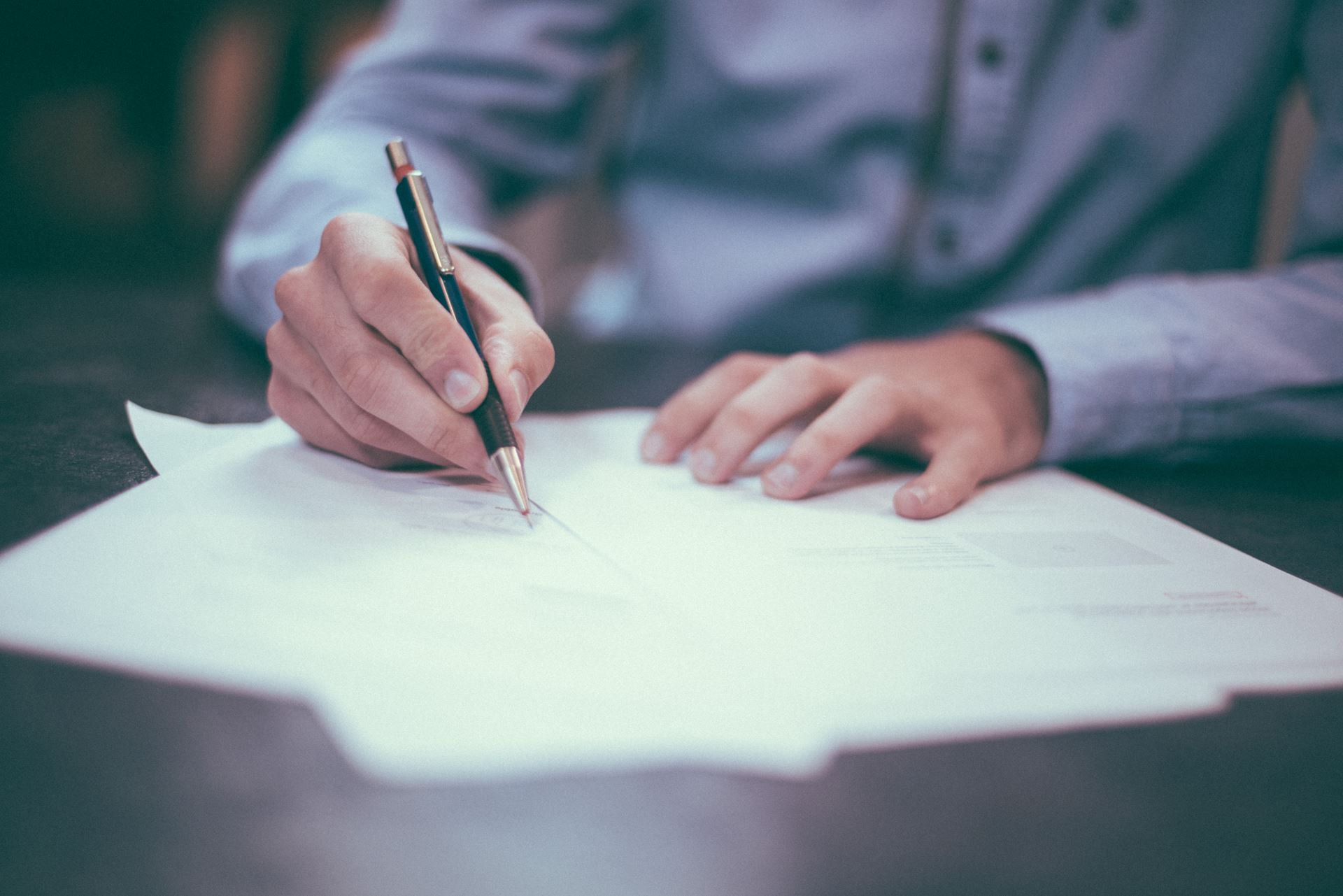 A man signing a certificate